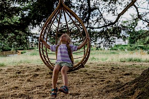 This image is a child in the garden by James Bowden, UK lifestyle photography, represented by Horton-Stephens photographer’s agents specialises in natural and authentic  lifestyle outdoors nature photographic images.