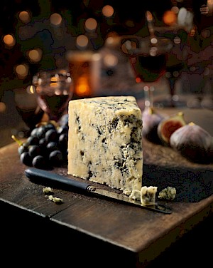 cheese board with grapes food - Diana Miller