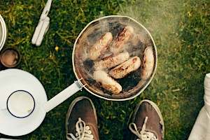 This colour photo shows a food and drink cooking outdoor scene by James Bowden, UK  photographer, represented by Horton-Stephens photographer’s agents specialises in natural and authentic  lifestyle outdoors nature photographic images.
