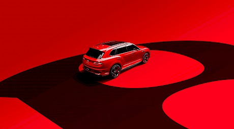 Bentley car shot from behind on a red graphic background in the studio by photographer Wilson Hennessy represented by London photo agents Horton-Stephens.