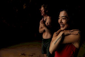 This colour photo shows models on a beach by James Bowden, UK  photographer, represented by Horton-Stephens photographer’s agents specialises in natural and authentic  lifestyle outdoors nature photographic images.
